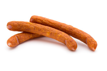 Stack of smoked sausages isolated on a white background.