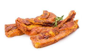 Spicy marinated spare ribs barbecued on the white background.