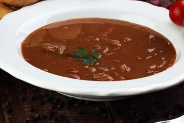 Tasty Hungarian beef goulash soup bograch close-up on the table and ingredient