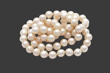 Closeup Pile of Pearls on Gray Background with Clipping Path