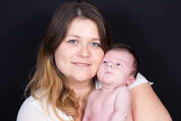 mother hug new born baby with love