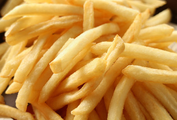 Close-up of oily French fries, unhealthy food