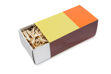 Big half open matchbox filled with matches on white background