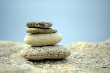 Fototapeta na wymiar Stacked tower of beach stones