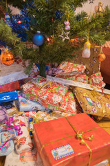 Fototapeta na wymiar Christmas presents under the tree