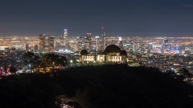 Griffith Observatory and Downtown Los Angeles. Zoom in Night Transition Timelapse