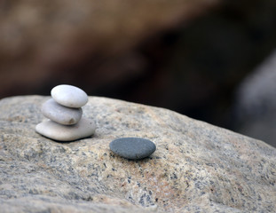 Fototapeta na wymiar Stacked tower of beach stones 