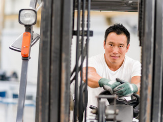 Asian worker in production plant on the factory floor