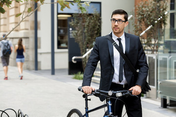 Young businessmen with a bike