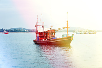 Fishing on an old boat at sunset