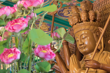 Wood carving of Guanyin in Wat Borom Raja Kanjanapisek,Thailand.