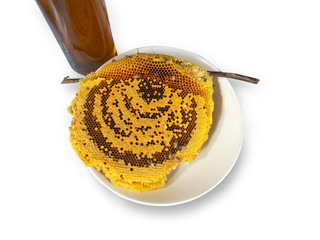 bees and honeycomb and a bottle of honeycomb