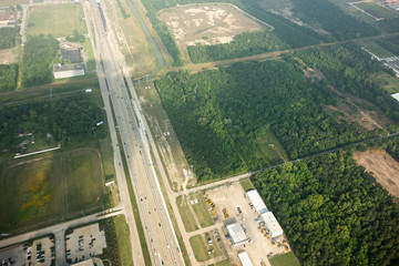 Fototapeta na wymiar aerial view of land and roads below