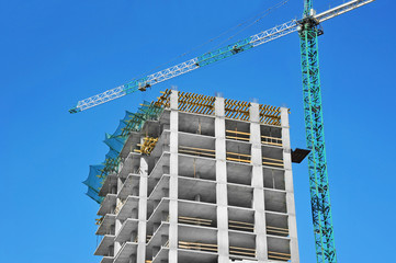 Crane and highrise construction site