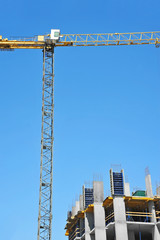 Crane and highrise construction site