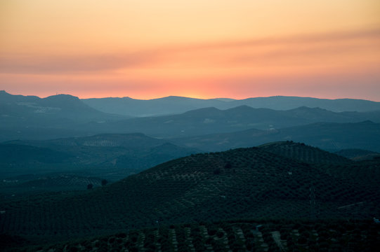 Panoramic and idyllic Andalusian landscape, mountain village Alcaudete at sunset