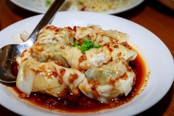 Chinese food - dim sum with red source