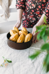 woman hold in hand pies house. Rustic style concept