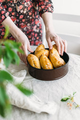 woman hold in hand pies house. Rustic style concept