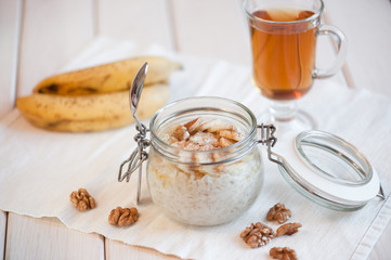 Oatmeal with banana and walnuts for breakfast