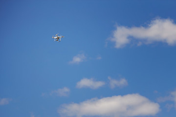 Quadrocopters flying on a sunny day