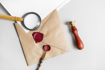Envelope, magnifier, seal, stamp, spoon on paper background. Responsive design mockup. Vintage...