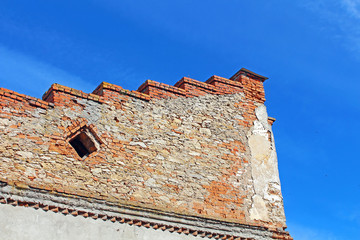 Wall over blue sky in Medzhybizh, Ukraine. Medzhybizh Castle, built as a bulwark against Ottoman...