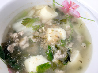 Thai Cuisine, Minced pork and soya bean curd soup in white blow on background, Thai food 