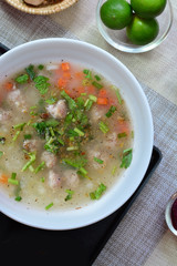 Close up rice porridge with pork on placemats 
