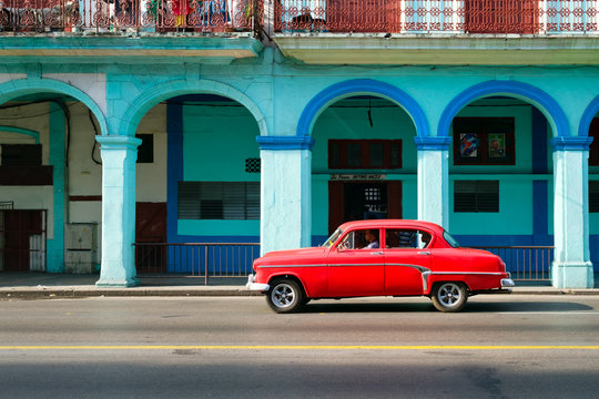 Classic american car in a colorful street in downtown Havana