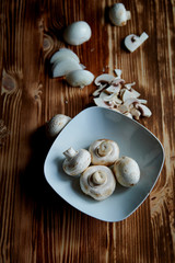The process of cooking.mushrooms whole and sliced