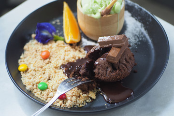 Chocolate lava dessert on black plate