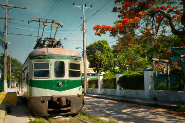 Vintage image of an old electric train in Cuba - obrazy, fototapety, plakaty
