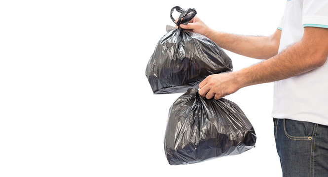Man hands holding garbage bag isolated on white background