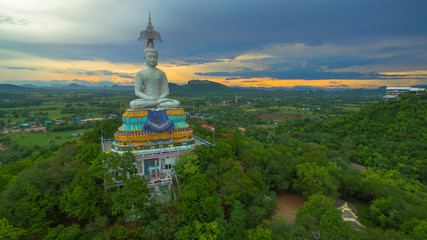 Fototapeta na wymiar sunset at big Buddha of Wat Nong Hoi