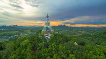 Fotobehang sunset at big Buddha of Wat Nong Hoi © Narong Niemhom