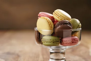 Peel and stick wall murals Macarons assorted macarons in glass bowl on wood table, closeup
