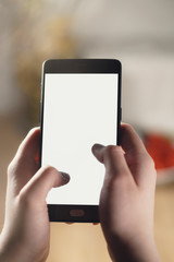 female teen hand using smartphone with blank white screen, shallow focus