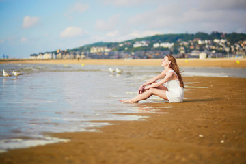 Woman enjoying her vacation by ocean or sea