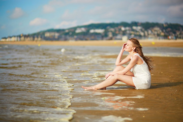 Fototapeta na wymiar Woman enjoying her vacation by ocean or sea