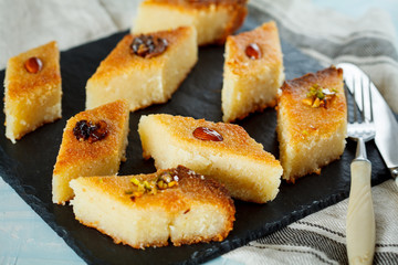 Arab traditional basbousa with different nuts. Eastern dessert from semolina.