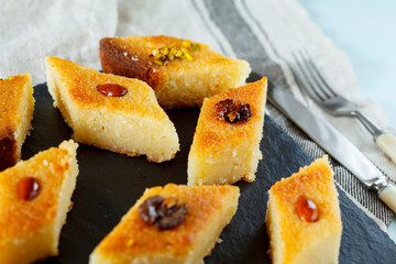 Arab traditional basbousa with different nuts. Eastern dessert from semolina.