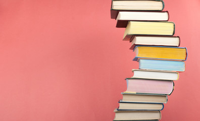 Open book, stacking, hardback books on wooden table and background. Back to school. Copy space for text,