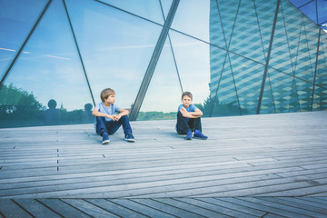 Two boys friends talking with each other
