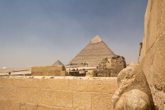Overlooking the Great Pyramid of Khufu from the funerary or mortuary temple with a statue