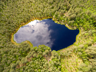 drone image. aerial view of rural area with lake in forest