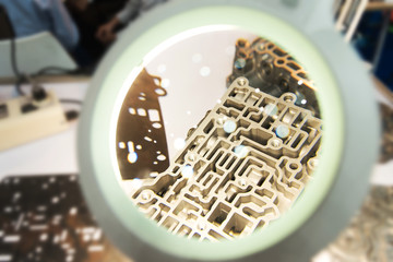 Industrial magnifying glass led lamp and closeup energy block automobile parts technology.