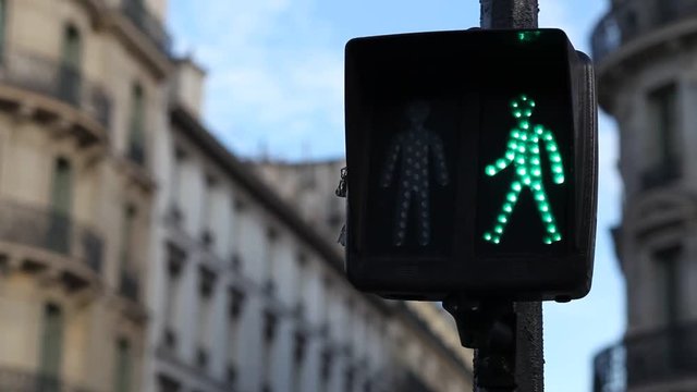 pedestrian crossing traffic light changing from green to red, stop signal