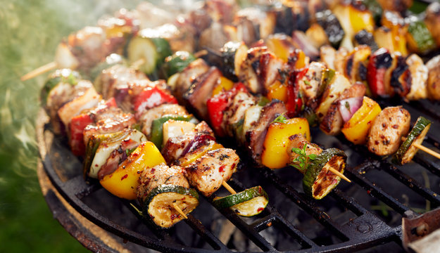Grilled skewers on a grilled plate, outdoor