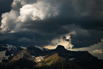 Storm clouds over snowy mountains in Banff National Park